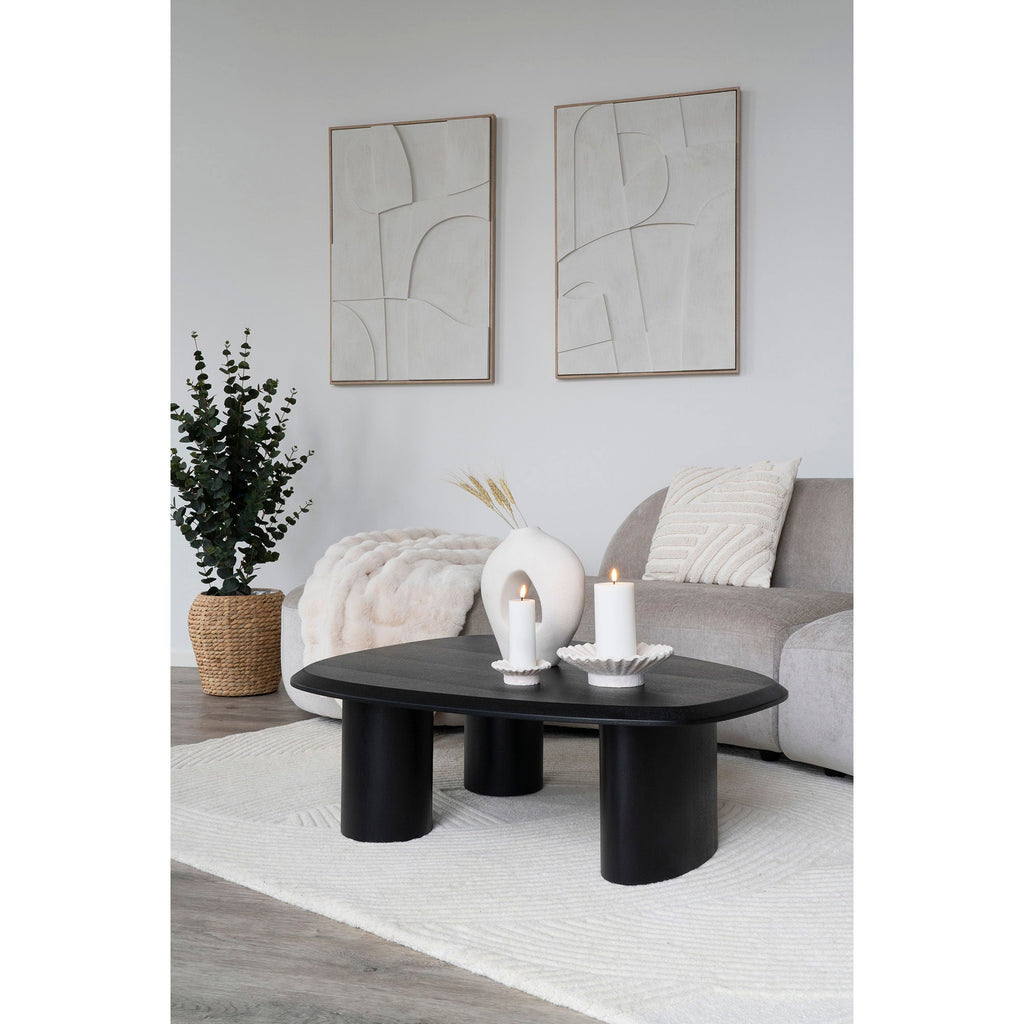 Table basse ovale noire aux pieds cylindriques épais, cadre blanc relief géométrique 60x90 cm